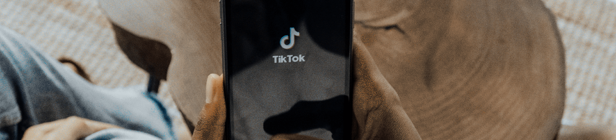 Woman using TikTok on a mobile phone with 4G mobile proxy VPN